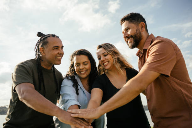 istock Friends with hands together celebrating 2181814603