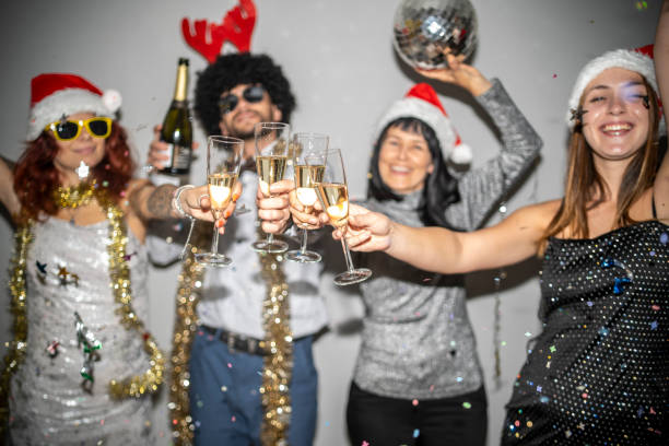 istock Joyful holiday celebration with friends and sparkling drinks 2181815559