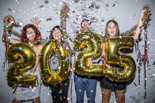 istock Celebration with golden balloons spelling 2025 and confetti joy. 2181815562