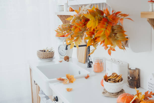 istock Charming autumn kitchen with vibrant leaves and seasonal decorations during the fall 2181816345