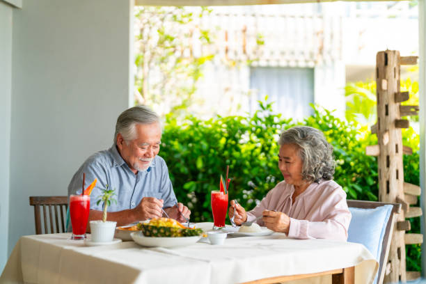 istock Asian senior couple having lunch at restaurant. 2181817572
