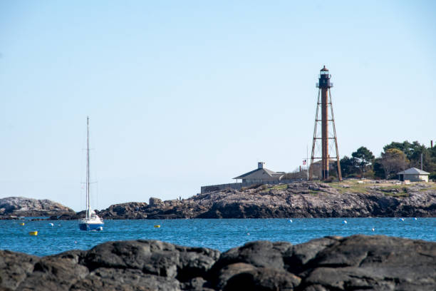 istock Marblehead Lighthouse and Moored Sailboat 2181819677