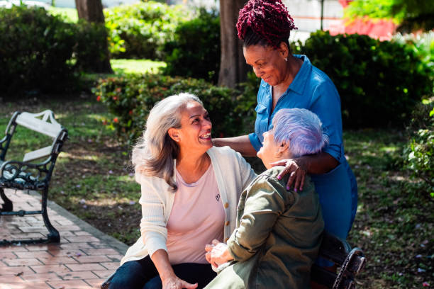 istock Senior friends talking on a public park 2181821672