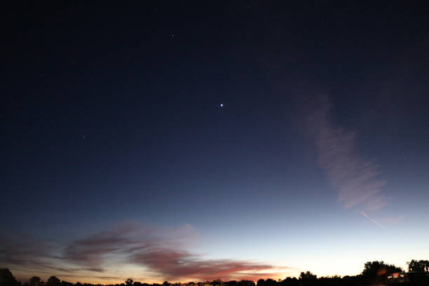 istock Sunset to the stars with a thin land view 2181822626