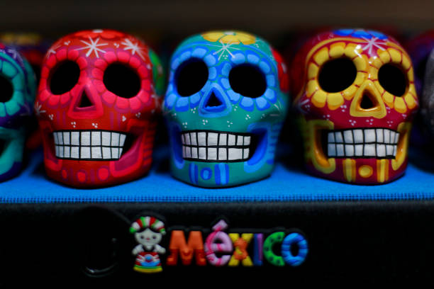Colorful skulls, Mexican handicrafts. Day of the Dead, handmade Huichol figure of chaquira, Mexico