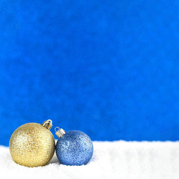 Christmas poster with copy space. Two ornaments in the snow