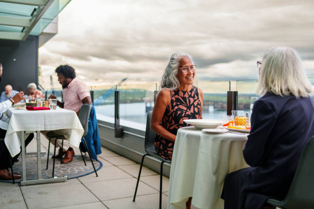 istock Pacific Islander senior woman having dinner with a friend 2181828509