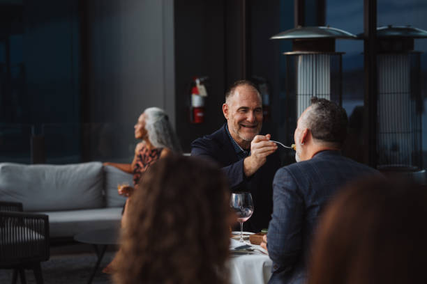 Couple on a date eating dinner on restaurant patio