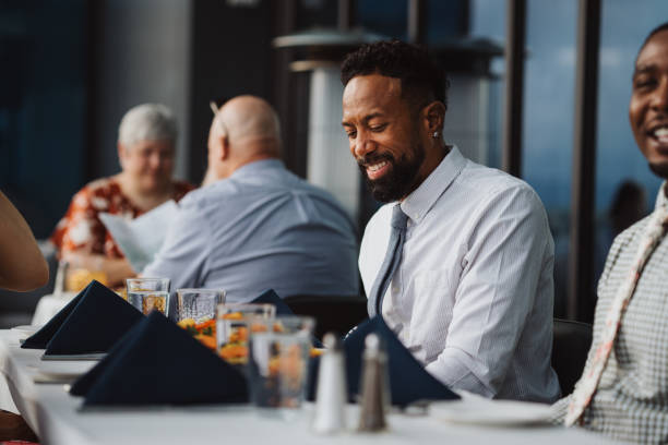istock Man dining out with friends at upscale restaurant 2181828637