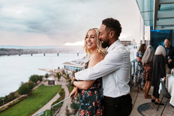 istock Affectionate couple enjoying sunset views from restaurant rooftop terrace 2181828650