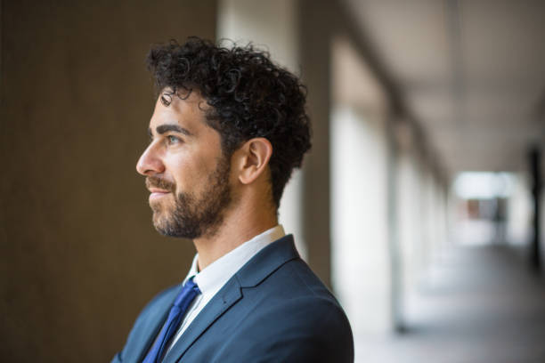 istock Confident Young Professional in a Modern Office Corridor 2181828850