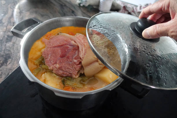 istock Vegetable soup with pork shank cooking in a casserole dish with lid 2181845008