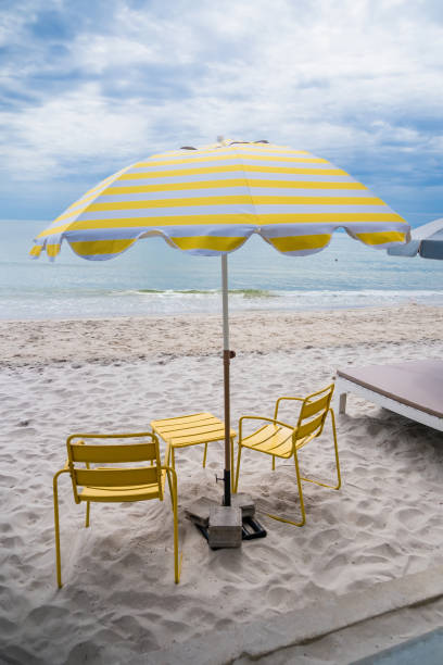 istock Yellow Umbrella by the Sea 2181846075