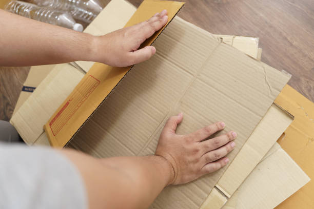 istock Home recycle eco zero waste concept Man using recycle paper box. Stacking brown cardboard box eco friendly packaging made of recyclable raw materials. 2181846683