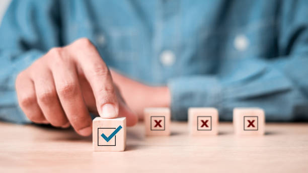 istock Businessman select blue correct sign mark between Red Cross mark which print screen on wooden for approve and reject business project proposal concept. 2181849017