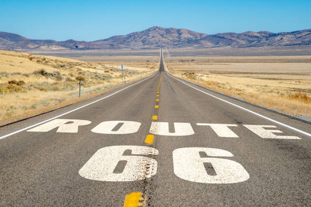 istock Long, straight desert highway with ROUTE 66 2181849930