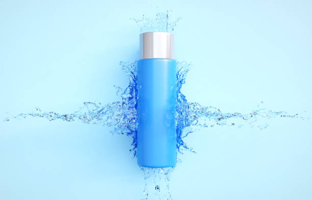 istock Cosmetic bottle with water splash on blue background 2181852975