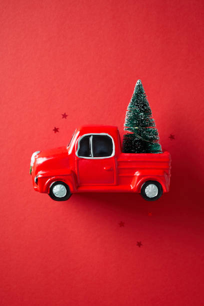 istock Vintage red truck with Christmas tree on red background 2181854560