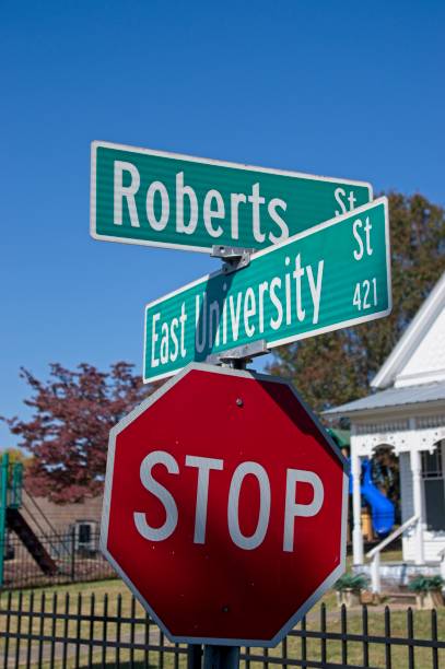 istock Street name signs over a red stop sign 2181855600