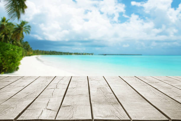 istock Empty wooden table top with beautiful tropical paradise island background 2181859302