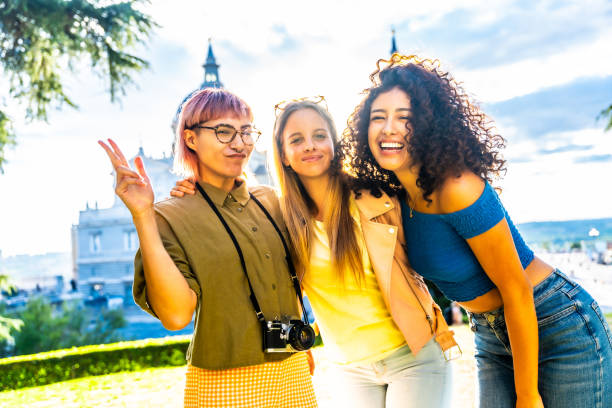 istock Happy travelers gesturing success while standing in a city viewpoint 2181859532
