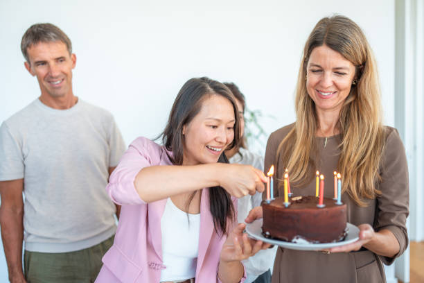 istock Diverse Team Celebrates Office Birthday with Candlelit Cake 2181859771
