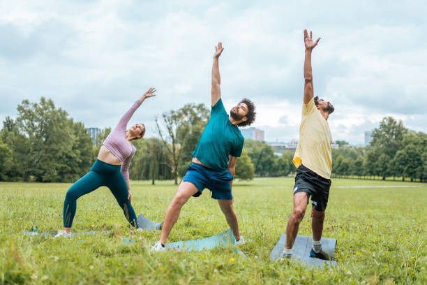 istock Diverse Group Engages in Outdoor Yoga Session 2181860089