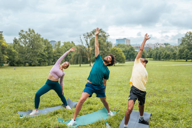 istock Diverse Group Practices Yoga Outdoors 2181860091