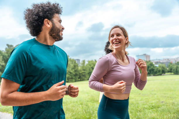 istock Multiethnic Friends Enjoying a Run in Urban Park 2181860115