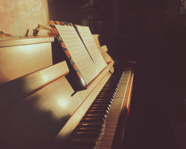 istock Music notes sheet placed on a piano in a sunlight 2181860854