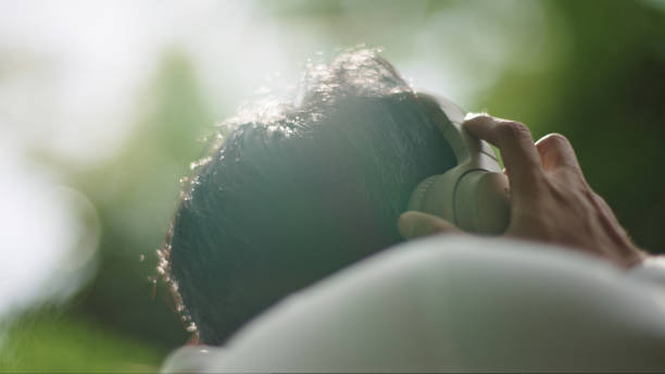 istock Man wear headphones while relaxing in nature. 2181861563