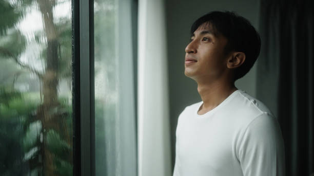 istock Man calmly at home with the rain. 2181862007
