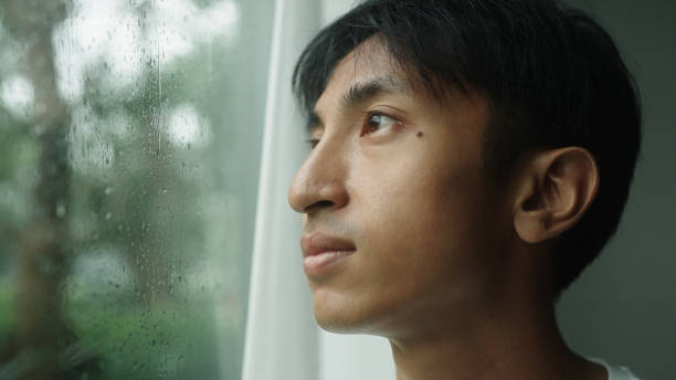 istock Man calmly at home with the rain. 2181862008