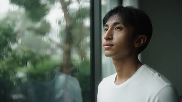 istock Man calmly at home with the rain. 2181862010