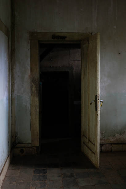 istock A creepy and dark atmosphere inside an abandoned house. 2181864021