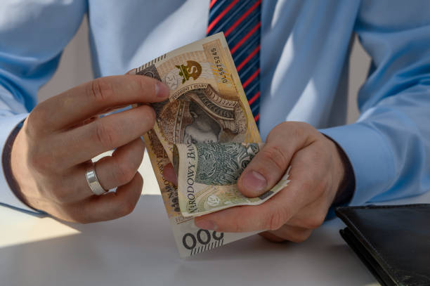 istock Businessman counting money in cash 2181865638