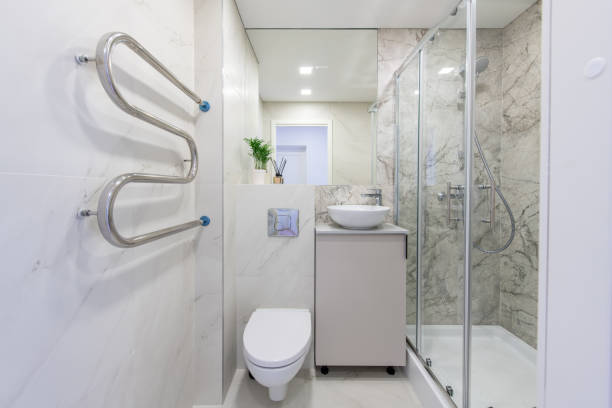 istock Bright Elegant Modern Luxury Home Bathroom Interior Design With White Sink. Marble Gray Walls, Mirror and Faucet. LED Lights. Shower Area, Heater, Tile Floor and Walls 2181867130