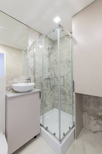 istock Bright Elegant Modern Luxury Home Bathroom Interior Design With White Sink. Marble Gray Walls, Mirror and Faucet. LED Lights. Shower Area, Heater, Tile Floor and Walls 2181867628