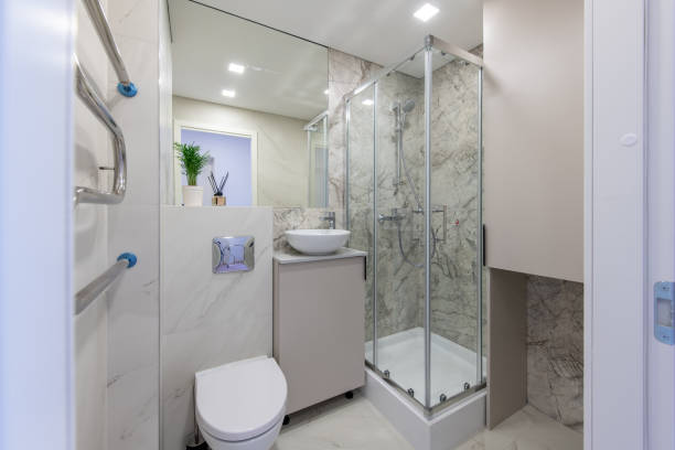istock Bright Elegant Modern Luxury Home Bathroom Interior Design With White Sink. Marble Gray Walls, Mirror and Faucet. LED Lights. Shower Area, Heater, Tile Floor and Walls 2181867970