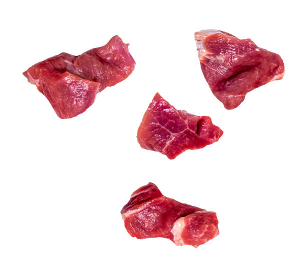 istock Four slices of falling raw beef meat isolated on white, clipping path, 2181872562