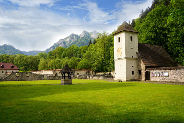 Scenic view of medieval Red Monastery with Three Crowns mountain massif in the background. 11.05.2024 Cerveny Klastor, Slovakia
