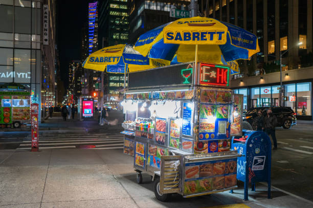 New York City, USA - Nov. 30th 2021: Sabrett's Hot Dog cart at night in  Midtown Manhattan, NYC, USA