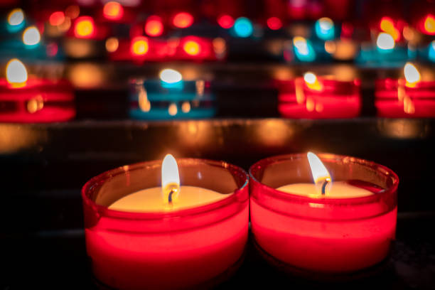 Sacred Radiance: Vibrant lights fill the quiet, dark interior of a church with color