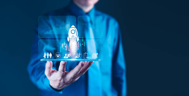 istock Launching a Successful Business: Man Holds Tablet with Rocket 2181876278