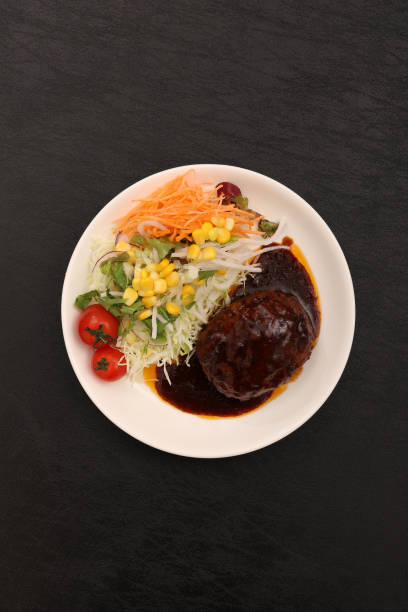 istock Hamburger steak and cherry tomato salad 2181882837