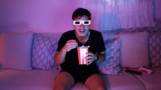 istock Excited man watching a movie with 3D glasses 2181885436