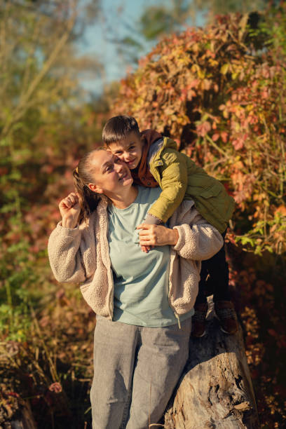 istock A mother and son enjoy quality time outdoors, promoting forest tours and active nature adventures for families. 2181889335