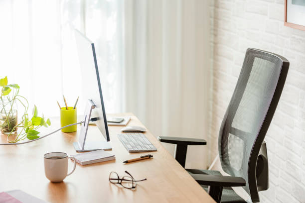 istock Work table with computer, office chair and office supplies 2181892207