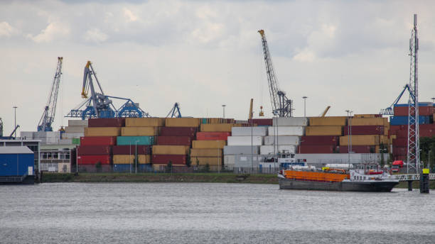 istock Cargo container ship at a container terminal in Rotterdam port, Netherlands 2181893289