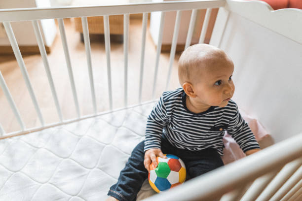 istock little kid in the crib at home 2181895335